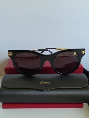 Cartier Black Sunglasses with Gold Emblems